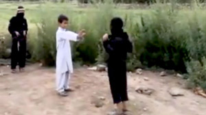 PHOTO A screengrab shown here from a disturbing video of children acting out a suicide bomb mission
