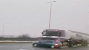 PHOTO A truck is shown pushing a car at 60 miles per hour in this screen grab from video.