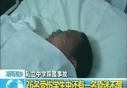 VIDEO: A crush of students descending a crowded staircase leads to death and injuries.
