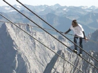 Tightrope Walker Climbs Into History