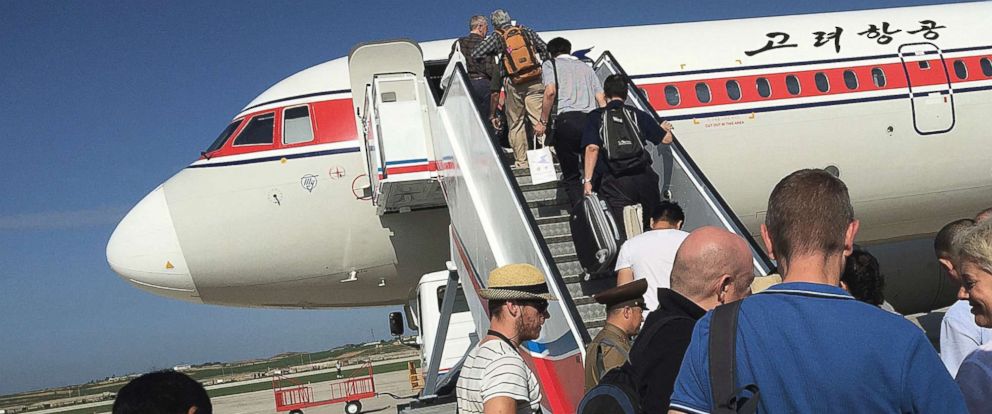 PHOTO: Passengers board an Air Koryo plane bound for Beijing, at the Pyongyang International Airport in Pyongyang, North Korea, June 27, 2015.