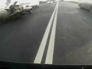 Watch: Caught on Tape: Driver Survives Collision With Truck