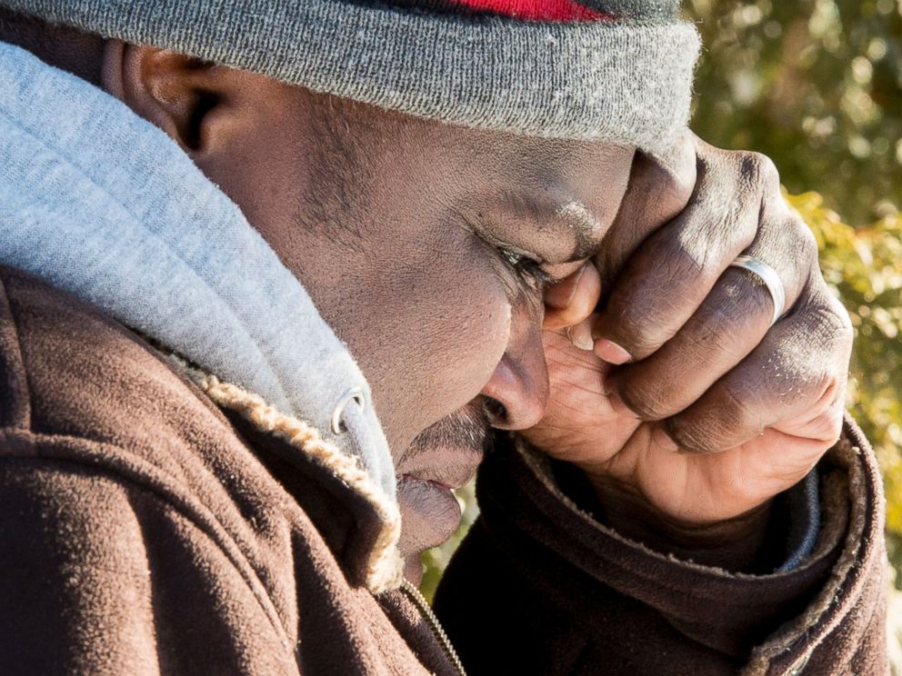 PHOTO: A Somali man wipes a tear after crossing the U.S.-Canada border into Canada near Hemmingford, Que., on Feb. 17, 2017.