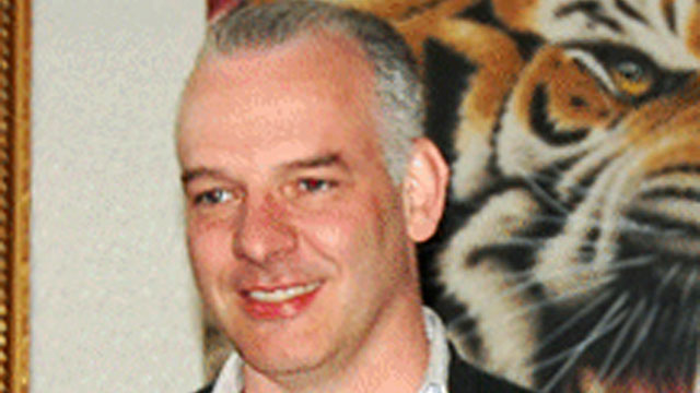 PHOTO: In this April 12, 2011 photo, British businessman Neil Heywood poses for photos at an art gallery in Beijing.
