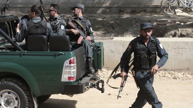 PHOTO: Afghan national security arrive near the entrance gate of the presidential palace in Kabul, Afghanistan Tuesday, June 25, 2013.