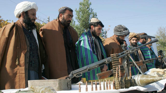 PHOTO: Taliban fighters line up as they hand over their weapons to join the peace process in Herat, Afghanistan, Nov. 3, 2012.