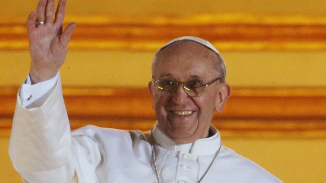 PHOTO: Pope Francis waves to the crowd from the central balcony of St. Peters Basilica at the Vatican, Wednesday, March 13, 2013. Cardinal Jorge Bergoglio, who chose the name of Francis is the 266th pontiff of the Roman Catholic Church.