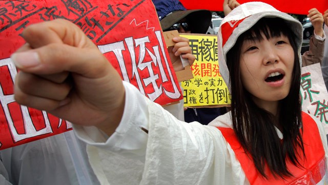 PHOTO: A demonstrator raises clenched fist during a rally, protesting against restarting the Ohi nuclear power plant's reactors in front of the prime minister's official residence in Tokyo, Saturday, June 16, 2012.