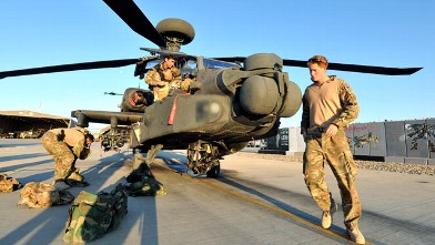 PHOTO: Prince Harry does a pre-flight check of his Apache Helicopter after starting his 12 hour VHR (very high ready-ness) shift at the British controlled flight-line in Camp Bastion southern Afghanistan, Nov. 1, 2012.
