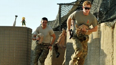 PHOTO: Prince Harry races out from the VHR (very high ready-ness) tent to scramble his Apache with fellow Pilots, during his 12 hour shift at the British controlled flight-line in Camp Bastion southern Afghanistan, Nov. 3 2012.
