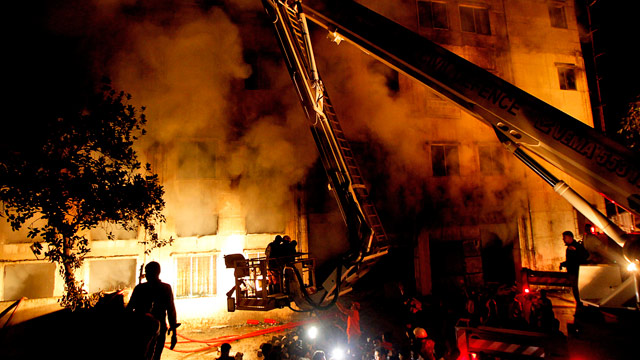 PHOTO: Bangladeshi firefighters battle a fire at a garment factory in the Savar neighborhood in Dhaka, Bangladesh, late Saturday, Nov. 24, 2012.