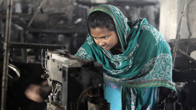PHOTO: A Bangladeshi garment worker inspects the damaged machinery inside the Smart Export Garment Ltd. factory where a fire Saturday claimed the lives of seven of her female colleagues in Dhaka, Bangladesh, Sunday, Jan. 27, 2013.