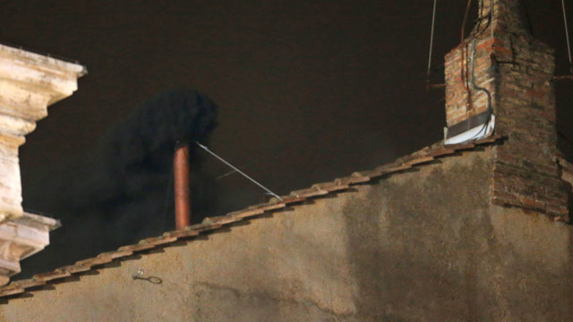 PHOTO: Blake smoke emerges from the chimney on the roof of the Sistine Chapel, in St. Peters Square at the Vatican, March 12, 2013. The black smoke indicates that the new pope has not been elected yet.