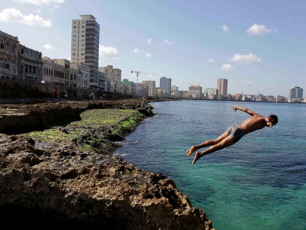 PHOTO: In this Nov. 28, 2011, file photo, a boy jumps into the water at the Malecon in Havana, Cuba.