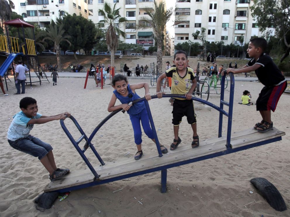 PHOTO: Palestinian children play in a public park during a temporary Hamas and Israel cease fire in Gaza City, Aug. 5, 2014.