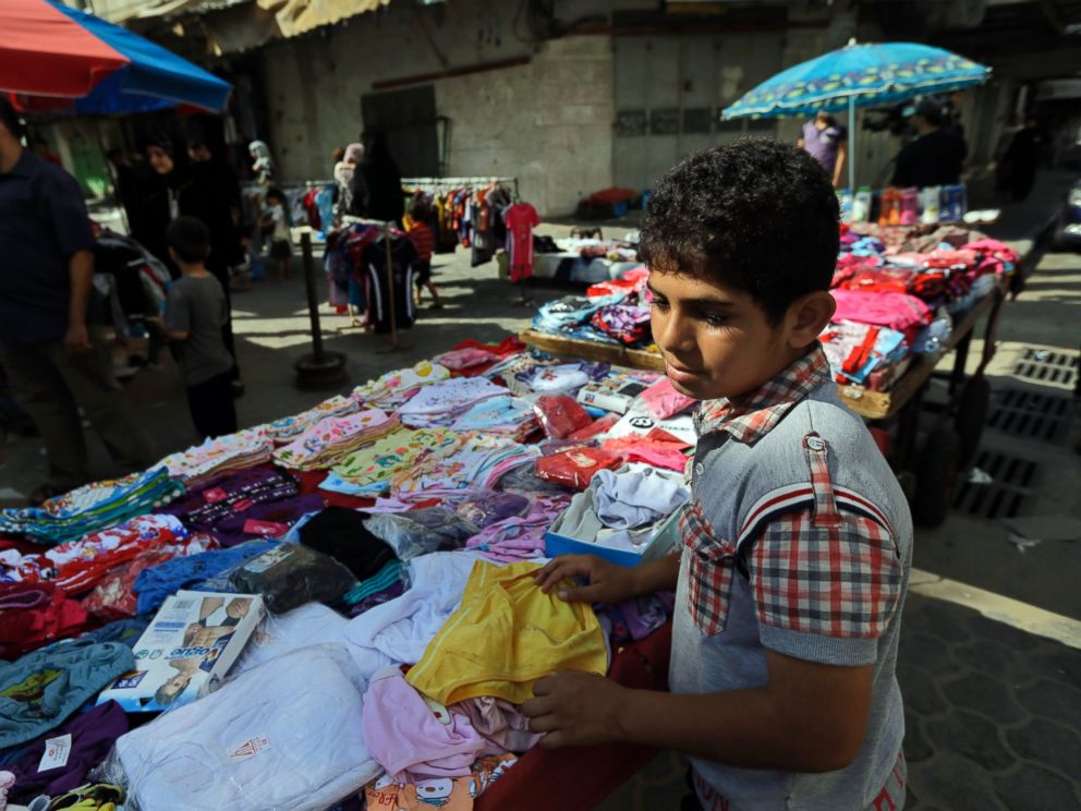 PHOTO: A Palestinian vendor arranges his merchandise at a market in Gaza City, northern Gaza Strip, Aug. 6, 2014.