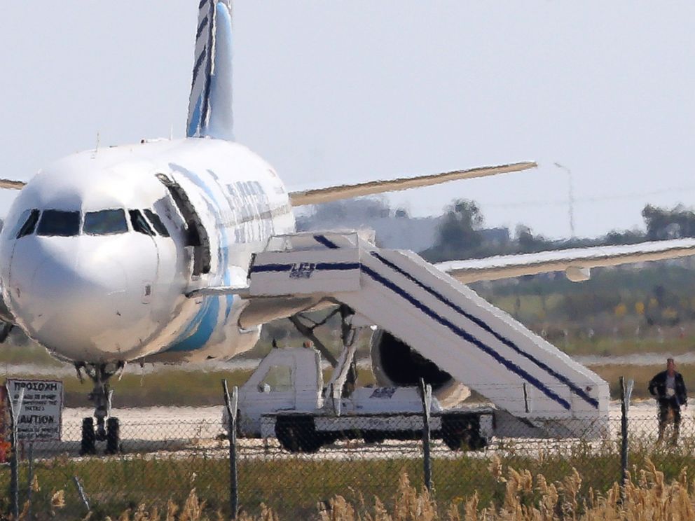 PHOTO: A man leaves the hijacked Egyptair plane at Larnaca airport on the island of Cyprus, March 29, 2016.