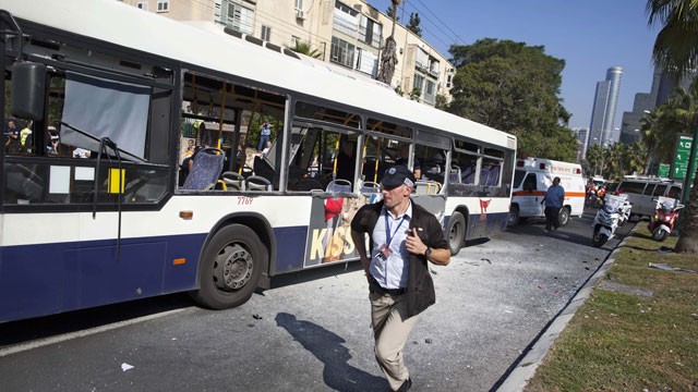 PHOTO:&nbsp;An Israeli security officer rushes to the site of a bombing in Tel Aviv, Israel, Wednesday, Nov. 21, 2012.