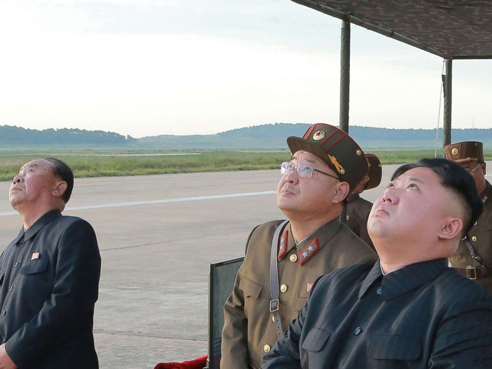 PHOTO: In this undated photo distributed on Sept. 16, 2017, by the North Korean government, leader Kim Jong Un, right, watches what was said to be the test launch of an intermediate range Hwasong-12 missile at an undisclosed location in North Korea.