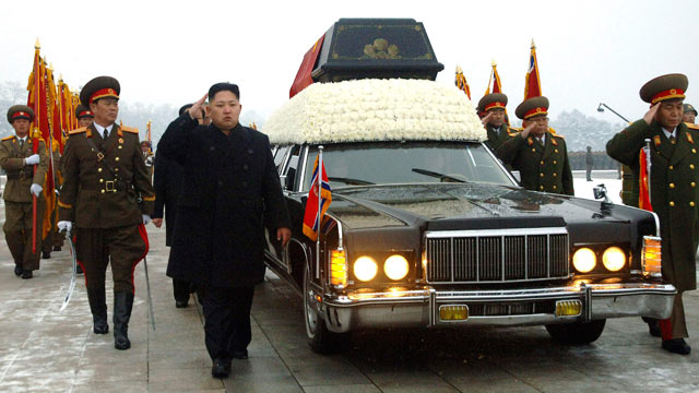 PHOTO: North Koreas next leader, Kim Jong Un, center, salutes as he walks beside the hearse carrying the body of his late father and North Korean leader Kim Jong Il during the funeral, in Pyongyang, North Korea, Dec. 28, 2011.