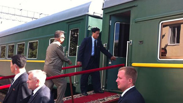 PHOTO: Kim Jong Il, walks up a ramp to enter the carriage of his armored train at the Bureya railway station, eastern Siberia, Russia, on his way to meet Russian President Dmitry Medvedev, August 21, 2011.