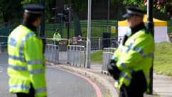 PHOTO: Police officers patrol the scene of a terror attack in Woolwich, southeast London, May 23, 2013.