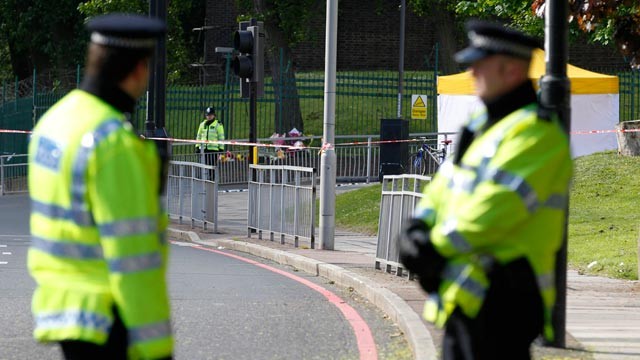 PHOTO: Police officers patrol the scene of a terror attack in Woolwich, southeast London, May 23, 2013.