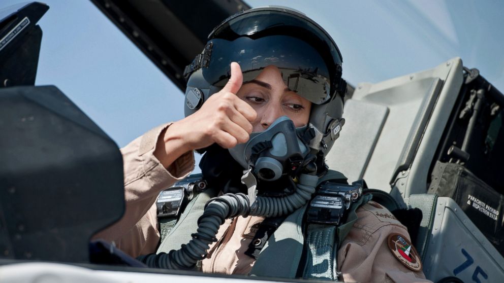 PHOTO:Mariam Al Mansouri, the first Emirati female fighter jet pilot, gives the thumbs up as she sits in the cockpit of an aircraft in United Arab Emirates June 13, 2013.