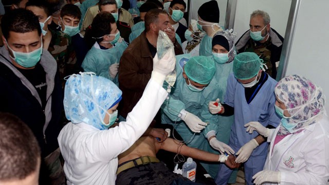 PHOTO: In this March 19, 2013 file photo released by the Syrian official news agency SANA, a Syrian victim who suffered an alleged chemical attack at Khan al-Assal village according to SANA, receives treatment by doctors at a hospital in Aleppo, Syria.