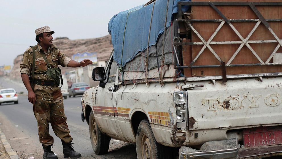 PHOTO: A Yemeni soldier stops a car at a checkpoint in a street leading to the U.S. embassy in Sanaa, Yemen, Sunday, Aug. 4, 2013.