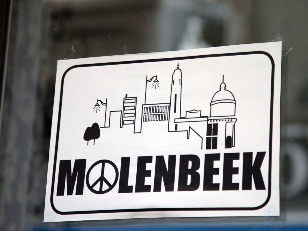PHOTO: A sign in a shop window reads Molenbeek with a peace sign, on the main shopping street of Molenbeek, Belgium, Nov. 18, 2015.