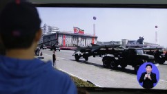 PHOTO: South Koreans watch TV news showing a footage of North Korean missiles on a military parade, at a Seoul Train Station in Seoul, South Korea, Saturday, May 18, 2013.