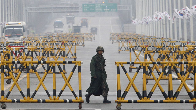 PHOTO: A South Korean Army soldier walks on Unification Bridge in Paju, South Korea, near the border village of Panmunjom, Saturday, April 6, 2013.