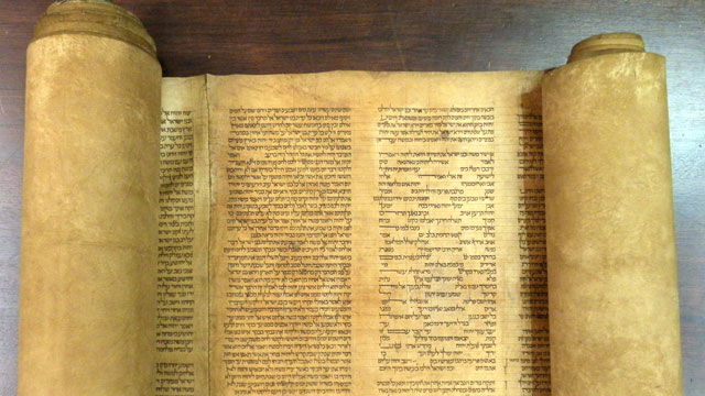 PHOTO: A document that an Italian expert says to be the oldest known complete Torah scroll is seen at the Alma mater Studiorum Universita di Bologna.