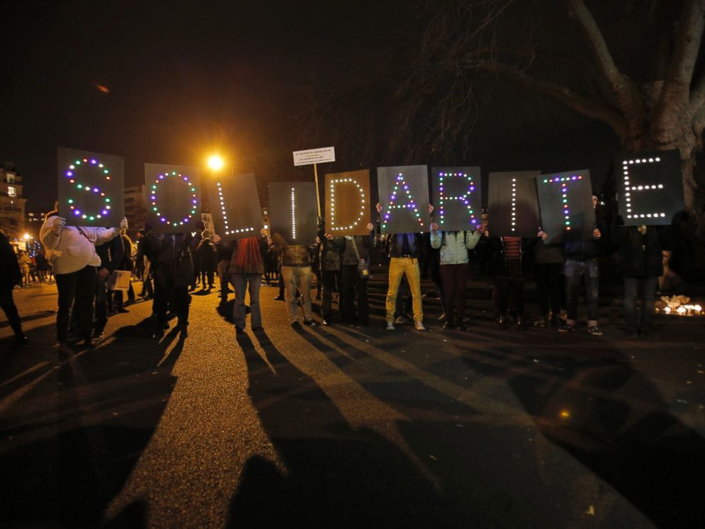PHOTO: People hold up a sign reading Solidarity during a rally in Paris, France, Sunday, Jan. 11, 2015.