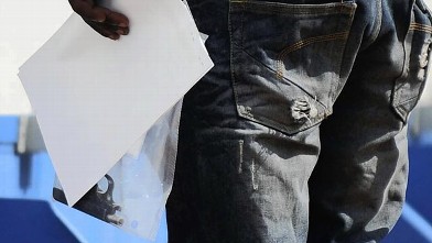 PHOTO: A police officer holds a gun, that was allegedly used in the shooting of Reeva Steenkamp, the girlfriend of Olympian athlete Oscar Pistorius, at the Boschkop, Pretoria, South Africa, Feb. 14, 2013.