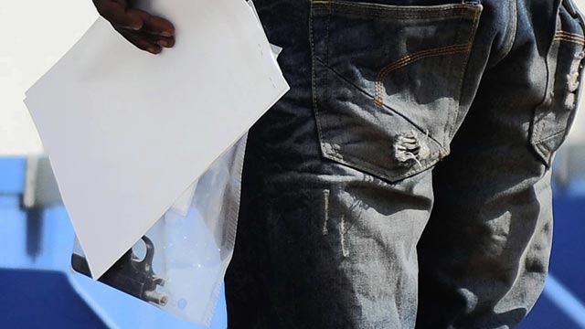 PHOTO: A police officer holds a gun, that was allegedly used in the shooting of Reeva Steenkamp, the girlfriend of Olympian athlete Oscar Pistorius, at the Boschkop, Pretoria, South Africa, Feb. 14, 2013.