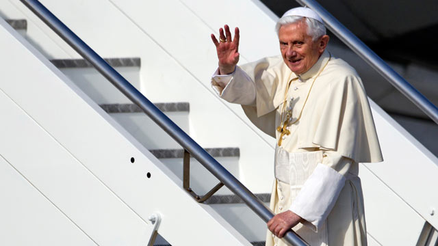 PHOTO: Pope Benedict XVI waves as he boards a plane on his way to a six-day visit to Mexico and Cuba, at Romes Fiumicino international airport on March 23, 2012.