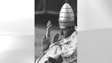 PHOTO: Pope Paul VI, wearing full pontifical robes and the papal tiara, raises his hands in answer to a cheering crowd while being carried from St. Peter's Basilica on his portable throne after a solemn Mass in the Basilica which celebrated the first anni