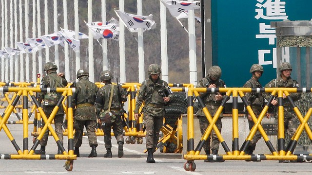 PHOTO: South Korean army soldiers stand guard on Unification Bridge in Paju, South Korea, near the border village of Panmunjom, Saturday, April 13, 2013.