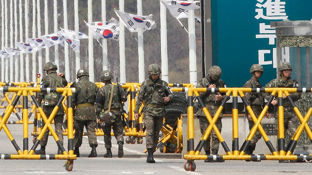 PHOTO: South Korean army soldiers stand guard on Unification Bridge in Paju, South Korea, near the border village of Panmunjom, Saturday, April 13, 2013.