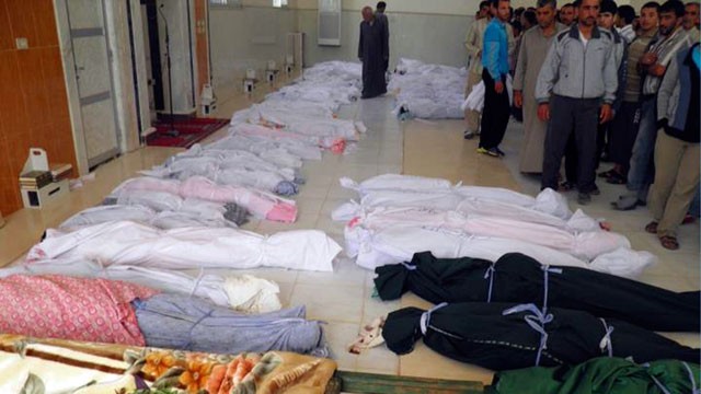 PHOTO: This citizen journalism image provided by Shaam News Network, May 26, 2012 purports to show shrouded dead bodies following a Syrian government assault on Houla, Syria.