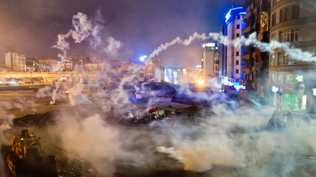 PHOTO: Taksim Square is flooded by tear gas as clashes between protesters and riot police continue into the night in Istanbul, June 11, 2013.