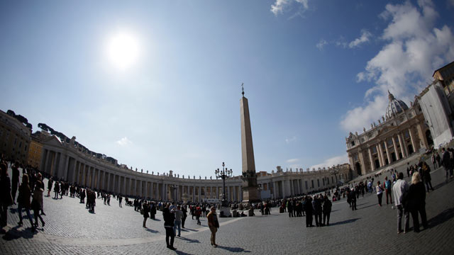 PHOTO: People walk in St. Peters Square at the Vatican, March 3, 2013.
