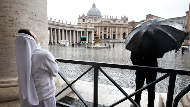 PHOTO: A nun watches the rain in St. Peters Square during the second day of the conclave to elect a new pope at the Vatican, March 13, 2013.