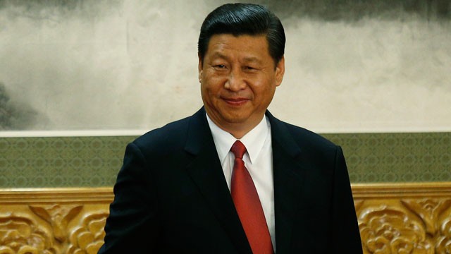 PHOTO: New Communist Party General Secretary Xi Jinping smiles as the new members of the Politburo Standing Committee applaud in Beijings Great Hall of the People, Nov. 15, 2012.