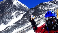 PHOTO: Japanese extreme skier Yuichiro Miura rests as he goes through the South Col pass to a camp at 8,000 meters (26,247 feet) during his attempt to scale the summit of Mount Everest, May 21, 2013.
