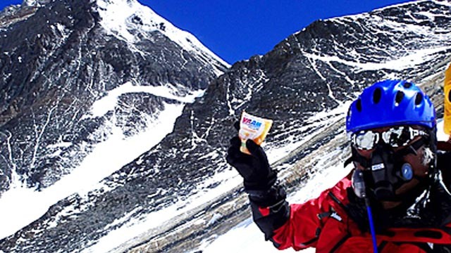 PHOTO: Japanese extreme skier Yuichiro Miura rests as he goes through the South Col pass to a camp at 8,000 meters (26,247 feet) during his attempt to scale the summit of Mount Everest, May 21, 2013.