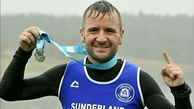 VIDEO: Marathon runner Rob Sloan was stripped of third-place title after caught hitching a ride.