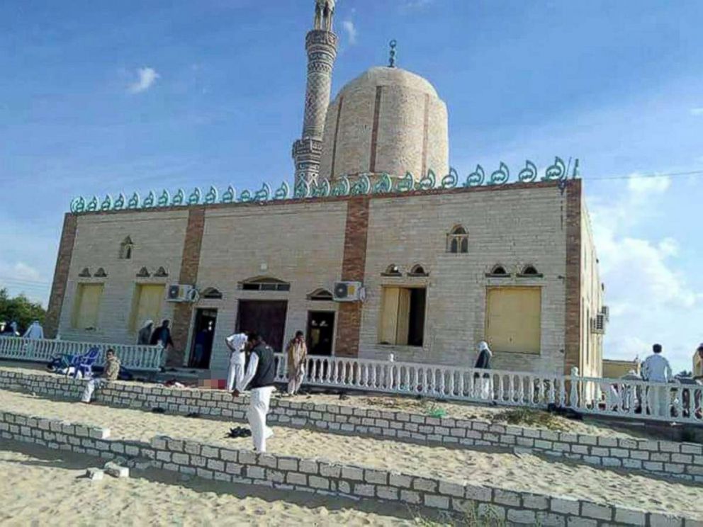 PHOTO: People walk outside a mosque that was attacked in the northern city of Arish, Sinai Peninsula, Egypt, Nov. 24, 2017.